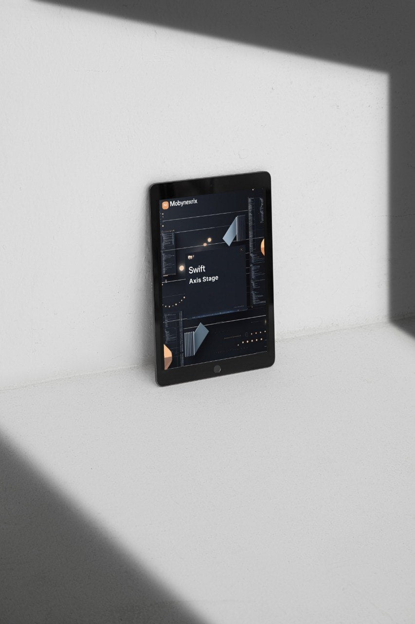 Black tablet on a white surface with a dark screen