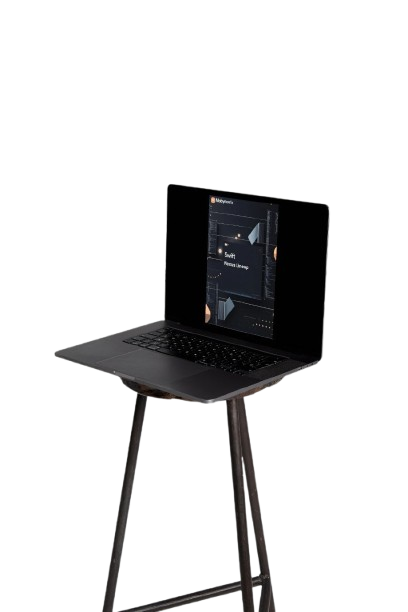 Black laptop on a black stool against a white background