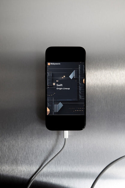 Smartphone with app interface on a metallic surface
